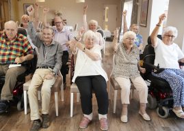 group-of-seniors-enjoying-fitness-class-in-retirement-home.jpg